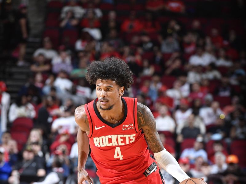 HOUSTON, TX - MARCH 25: Jalen Green #4 of the Houston Rockets handles the ball during the game against the Portland Trail Blazers on March 25, 2024 at the Toyota Center in Houston, Texas. NOTE TO USER: User expressly acknowledges and agrees that, by downloading and or using this photograph, User is consenting to the terms and conditions of the Getty Images License Agreement. Mandatory Copyright Notice: Copyright 2024 NBAE (Photo by Logan Riely/NBAE via Getty Images)