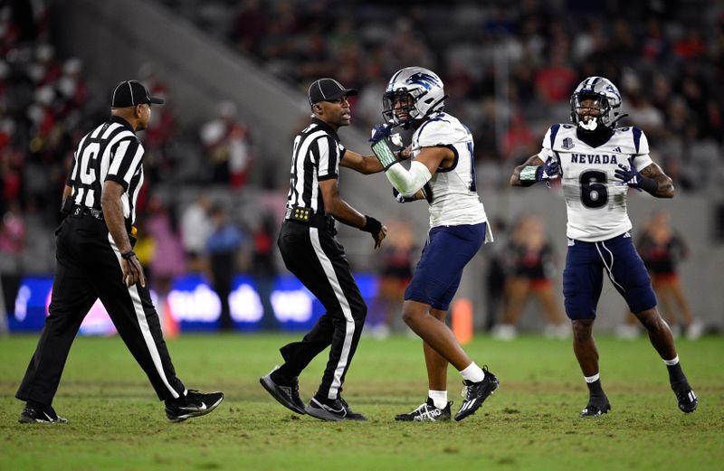 Oct 21, 2023; San Diego, California, USA; Nevada Wolf Pack defensive backs KK Meier (10) and Jaden Dedman (6) celebrate after a San Diego State Aztecs turnover during the second half at Snapdragon Stadium. Mandatory Credit: Orlando Ramirez-USA TODAY Sports 