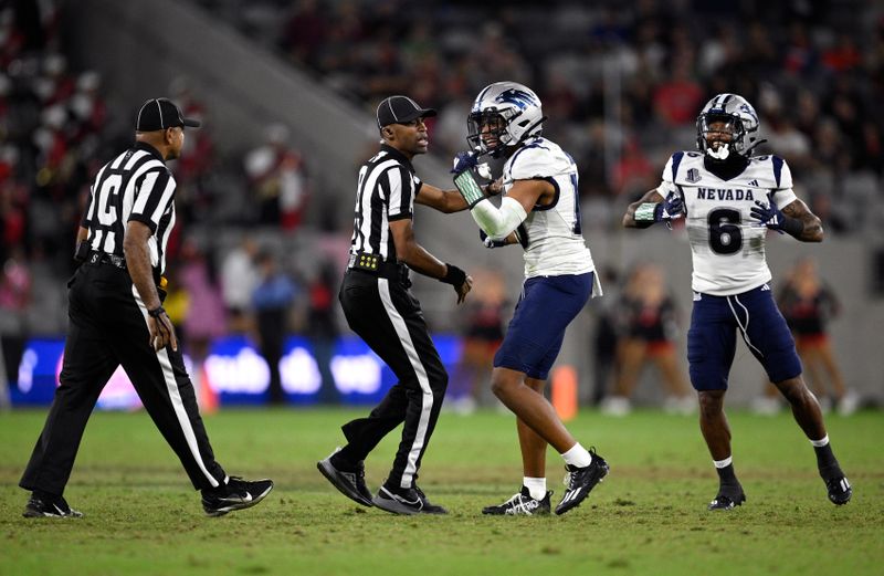 Oct 21, 2023; San Diego, California, USA; Nevada Wolf Pack defensive backs KK Meier (10) and Jaden Dedman (6) celebrate after a San Diego State Aztecs turnover during the second half at Snapdragon Stadium. Mandatory Credit: Orlando Ramirez-USA TODAY Sports 