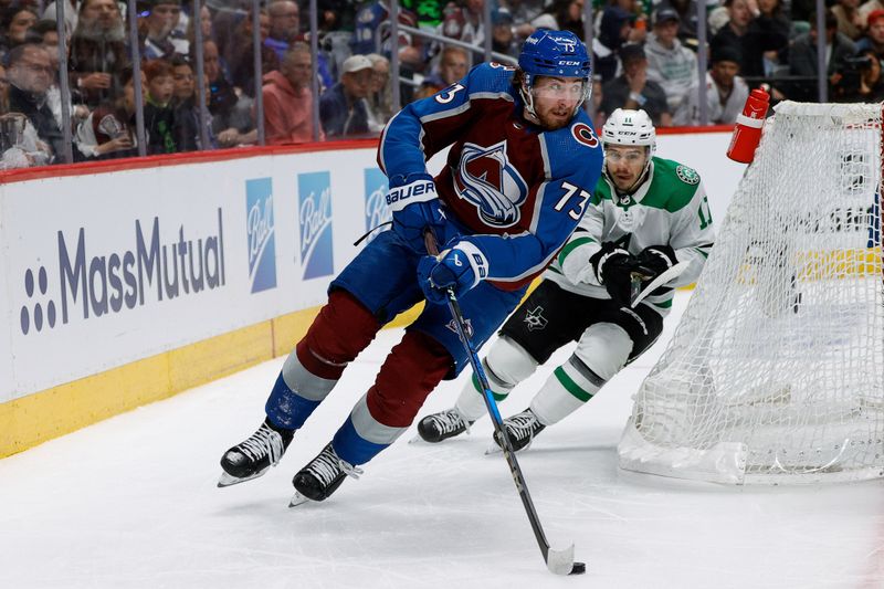 May 11, 2024; Denver, Colorado, USA; Colorado Avalanche center Yakov Trenin (73) controls the puck ahead of Dallas Stars center Logan Stankoven (11) in the third period in game three of the second round of the 2024 Stanley Cup Playoffs at Ball Arena. Mandatory Credit: Isaiah J. Downing-USA TODAY Sports