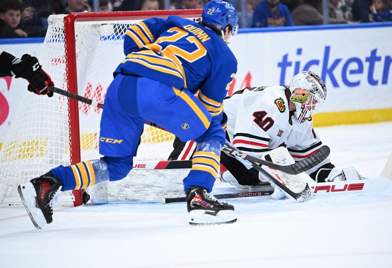 Nov 21, 2025; Buffalo, New York, USA; Chicago Blackhawks goaltender Arvid Soderblom (40) blocks a shot by Buffalo Sabres right wing Jack Quinn (22) in the second period at KeyBank Center. Mandatory Credit: Mark Konezny-Imagn Images