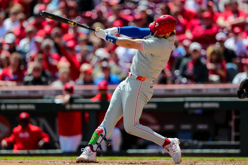 Apr 25, 2024; Cincinnati, Ohio, USA; Philadelphia Phillies first baseman Bryce Harper (3) hits a single against the Cincinnati Reds in the fifth inning at Great American Ball Park. Mandatory Credit: Katie Stratman-USA TODAY Sports