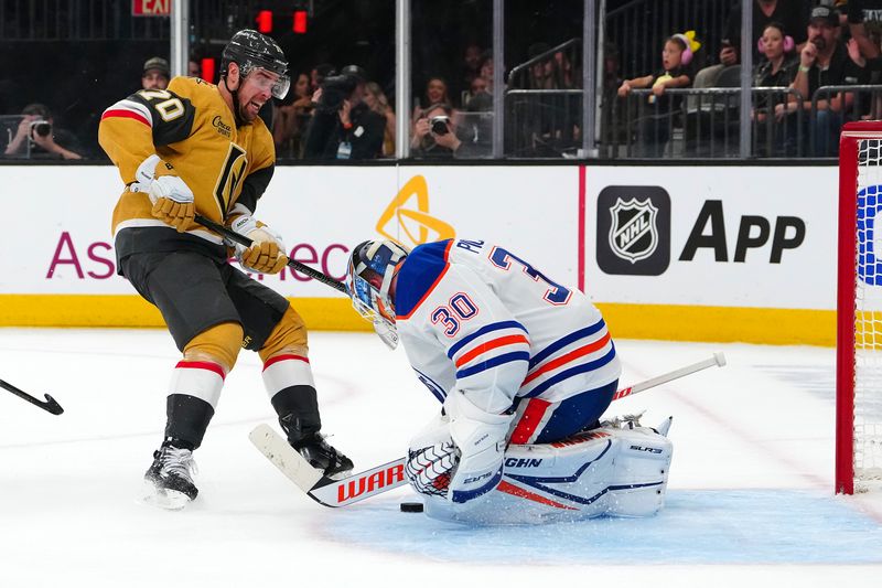 May 8, 2025; Las Vegas, Nevada, USA; Edmonton Oilers goaltender Calvin Pickard (30) makes a save against Vegas Golden Knights left wing Tanner Pearson (70) during the second period of game two of the second round of the 2025 Stanley Cup Playoffs at T-Mobile Arena. Mandatory Credit: Stephen R. Sylvanie-Imagn Images