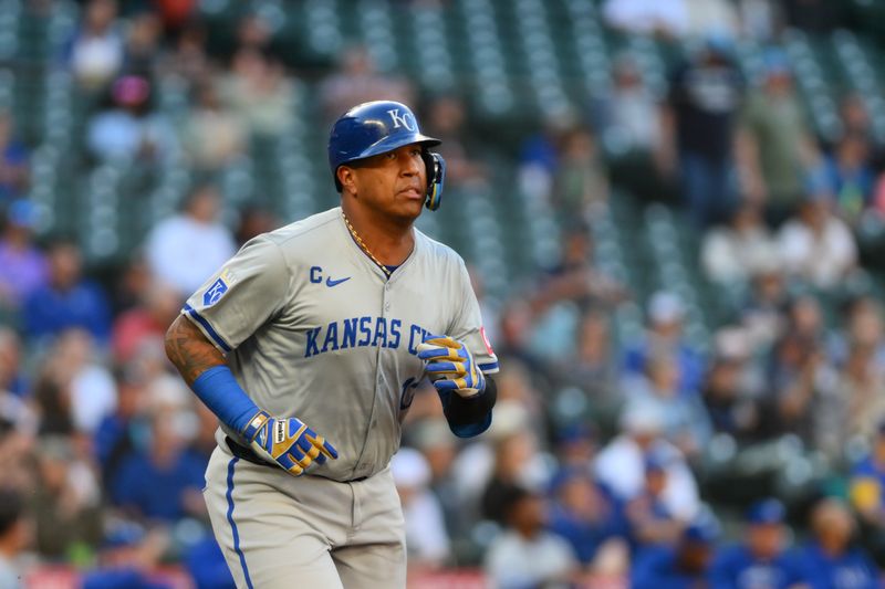 May 14, 2024; Seattle, Washington, USA; Kansas City Royals catcher Salvador Perez (13) runs towards first base after hitting a single against the Seattle Mariners during the second inning at T-Mobile Park. Mandatory Credit: Steven Bisig-USA TODAY Sports