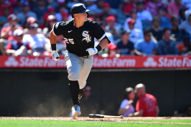 Jun 29, 2023; Anaheim, California, USA; Chicago White Sox first baseman Andrew Vaughn (25) hits an  RBI triple against the Los Angeles Angels during the ninth inning at Angel Stadium. Mandatory Credit: Gary A. Vasquez-USA TODAY Sports