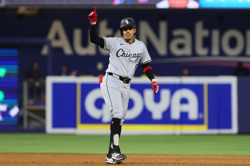 Jul 5, 2024; Miami, Florida, USA; Chicago White Sox second baseman Nicky Lopez (8) reacts from second base after hitting an RBI double against the Miami Marlins during the fifth inning at loanDepot Park. Mandatory Credit: Sam Navarro-USA TODAY Sports