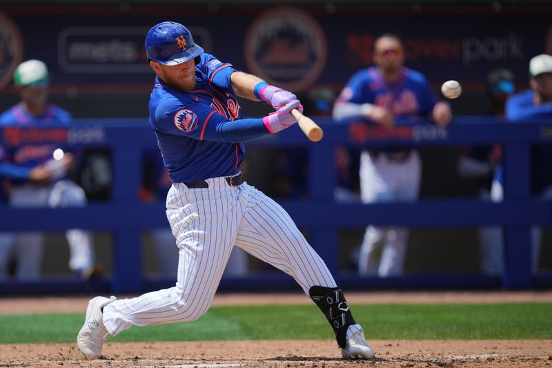 Mar 17, 2024; Port St. Lucie, Florida, USA;  New York Mets center fielder Harrison Bader hits a double against the Miami Marlins in the third inning at Clover Park. Mandatory Credit: Jim Rassol-USA TODAY Sports