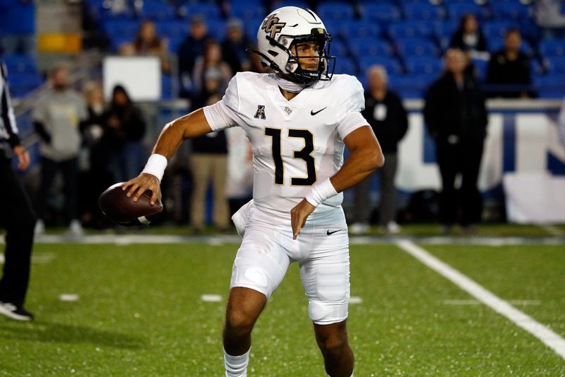 Nov 5, 2022; Memphis, Tennessee, USA; UCF Knights quarterback Mikey Keene (13) passes the ball during the second half against the Memphis Tigers at Liberty Bowl Memorial Stadium. Mandatory Credit: Petre Thomas-USA TODAY Sports