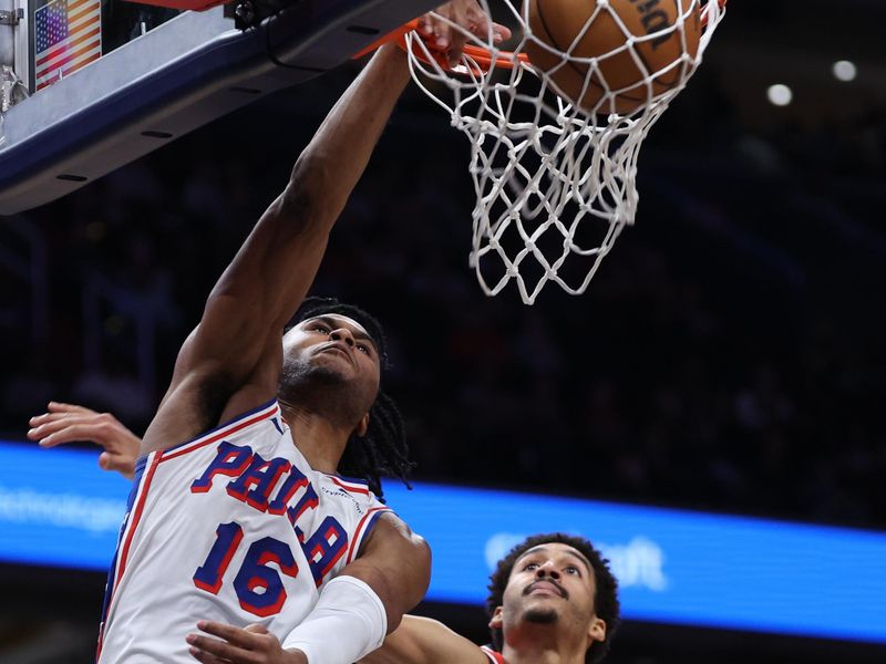 WASHINGTON, DC - FEBRUARY 10: Ricky Council IV #16 of the Philadelphia 76ers dunks in front of Jordan Poole #13 of the Washington Wizards during the second half at Capital One Arena on February 10, 2024 in Washington, DC. NOTE TO USER: User expressly acknowledges and agrees that, by downloading and or using this photograph, User is consenting to the terms and conditions of the Getty Images License Agreement.  (Photo by Patrick Smith/Getty Images)