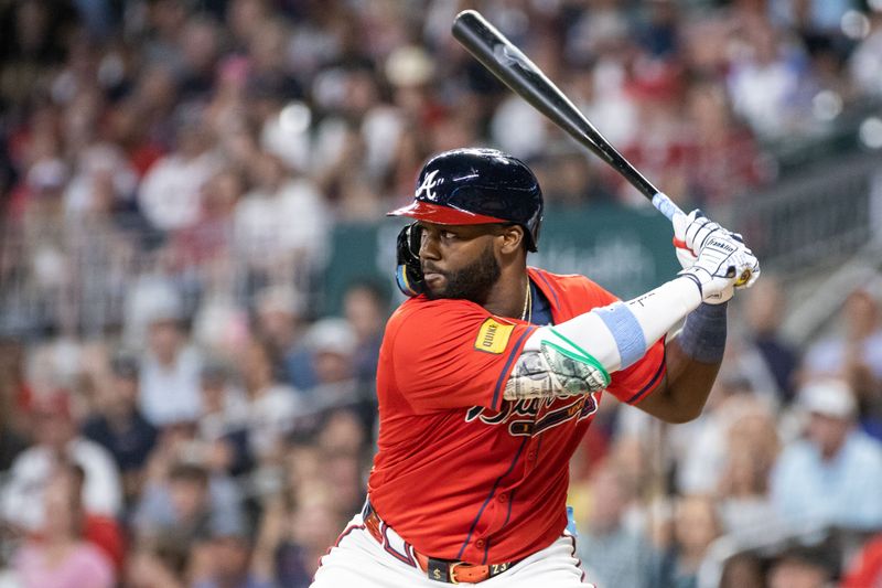 Aug 23, 2024; Cumberland, Georgia, USA; Atlanta Braves outfielder Michael Harris II (23) waits for the pitch in the game against Washington Nationals during the tenth inning at Truist Park. Mandatory Credit: Jordan Godfree-USA TODAY Sports