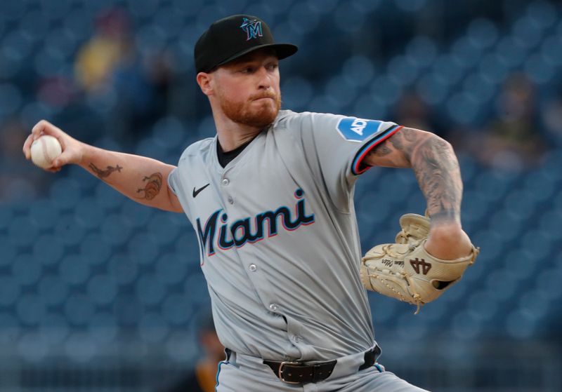 Sep 10, 2024; Pittsburgh, Pennsylvania, USA;  Miami Marlins starting pitcher Adam Oller (77) delivers a pitch against the Pittsburgh Pirates during the first inning at PNC Park. Mandatory Credit: Charles LeClaire-Imagn Images