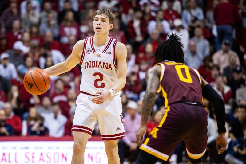 Jan 12, 2024; Bloomington, Indiana, USA; Indiana Hoosiers guard Gabe Cupps (2) dribbles the ball while Minnesota Golden Gophers guard Elijah Hawkins (0) defends in the first half at Simon Skjodt Assembly Hall. Mandatory Credit: Trevor Ruszkowski-USA TODAY Sports