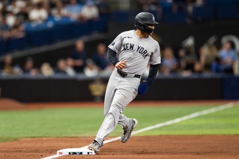 May 11, 2024; St. Petersburg, Florida, USA; New York Yankees outfielder Trent Grisham (12) runs to third base against the Tampa Bay Rays during the seventh inning at Tropicana Field. Mandatory Credit: Matt Pendleton-USA TODAY Sports