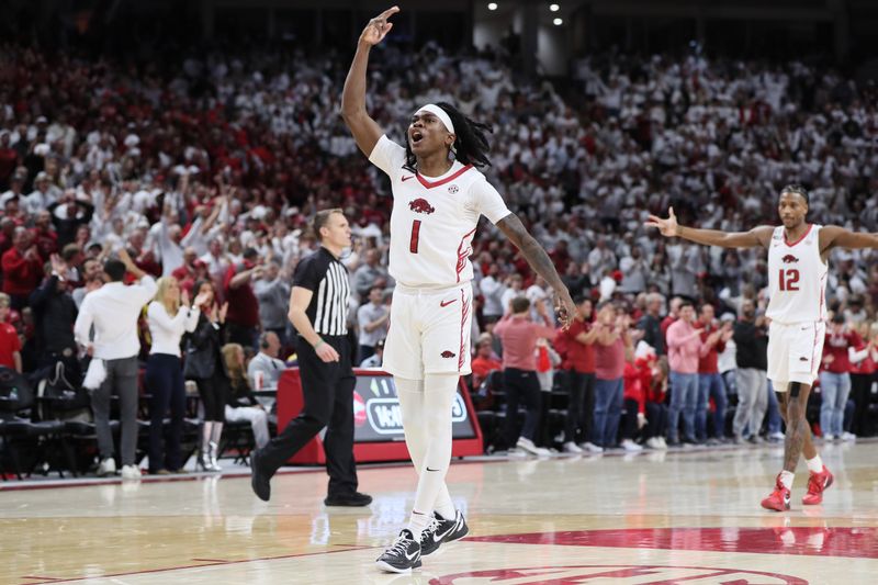 Jan 6, 2024; Fayetteville, Arkansas, USA; Arkansas Razorbacks guard Keyon Menifield Jr (1) celebrates after making a three point shot in the first half against the Auburn Tigers at Bud Walton Arena. Mandatory Credit: Nelson Chenault-USA TODAY Sports