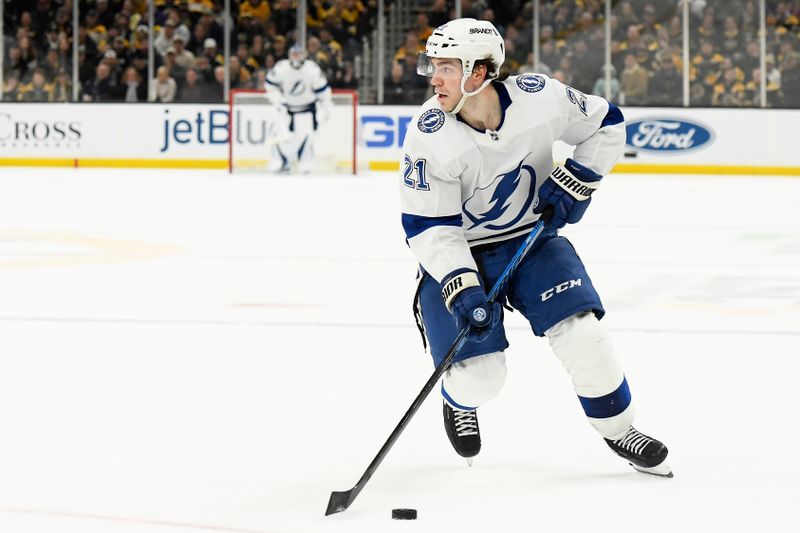 Feb 13, 2024; Boston, Massachusetts, USA;  Tampa Bay Lightning center Brayden Point (21) controls the puck during the overtime against the Boston Bruins at TD Garden. Mandatory Credit: Bob DeChiara-USA TODAY Sports