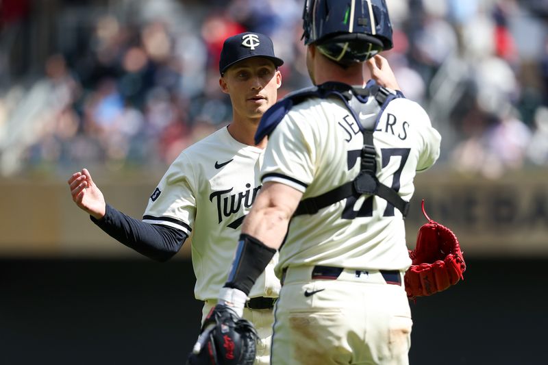 Apr 25, 2024; Minneapolis, Minnesota, USA; Minnesota Twins pitcher Griffin Jax (22) and catcher Ryan Jeffers (27) celebrate the win after the game against the Chicago White Sox at Target Field. Mandatory Credit: Matt Krohn-USA TODAY Sports
