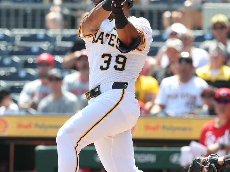 Aug 10, 2025; Pittsburgh, Pennsylvania, USA;  Pittsburgh Pirates second baseman Nick Gonzales (39) hits a double against the Cincinnati Reds during the fifth inning at PNC Park. Mandatory Credit: Charles LeClaire-Imagn Images
