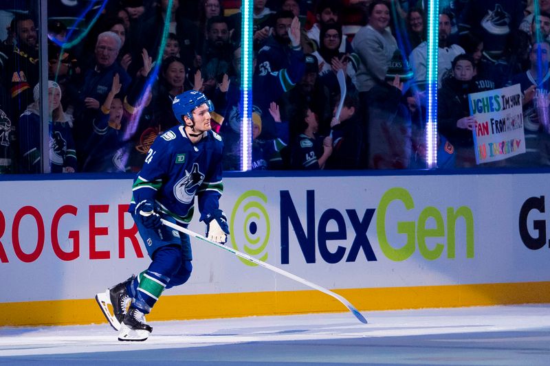 Jan 2, 2024; Vancouver, British Columbia, CAN; Vancouver Canucks forward Pius Suter (24) skates onto the ice after being named the second star of the game after the victory  against the Ottawa Senators at Rogers Arena. Mandatory Credit: Bob Frid-USA TODAY Sports