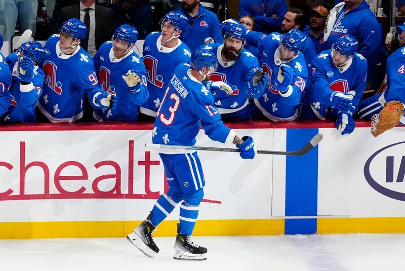 Oct 23, 2025; Denver, Colorado, USA; Colorado Avalanche right wing Valeri Nichushkin (13) celebrates his third period goal against the Carolina Hurricanes at Ball Arena. Mandatory Credit: Ron Chenoy-Imagn Images