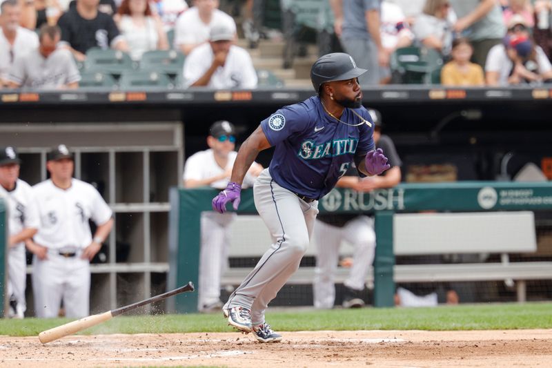 Jul 28, 2024; Chicago, Illinois, USA; Seattle Mariners outfielder Randy Arozarena (56) singles against the Chicago White Sox during the second inning at Guaranteed Rate Field. Mandatory Credit: Kamil Krzaczynski-USA TODAY Sports