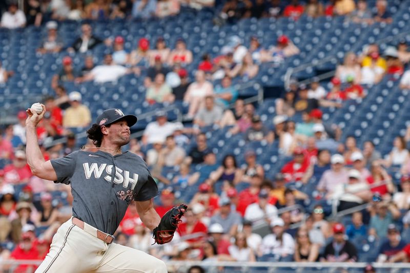 May 25, 2024; Washington, District of Columbia, USA; Washington Nationals pitcher Kyle Finnegan (67) pitches against the Seattle Mariners during the ninth inning at Nationals Park. Mandatory Credit: Geoff Burke-USA TODAY Sports