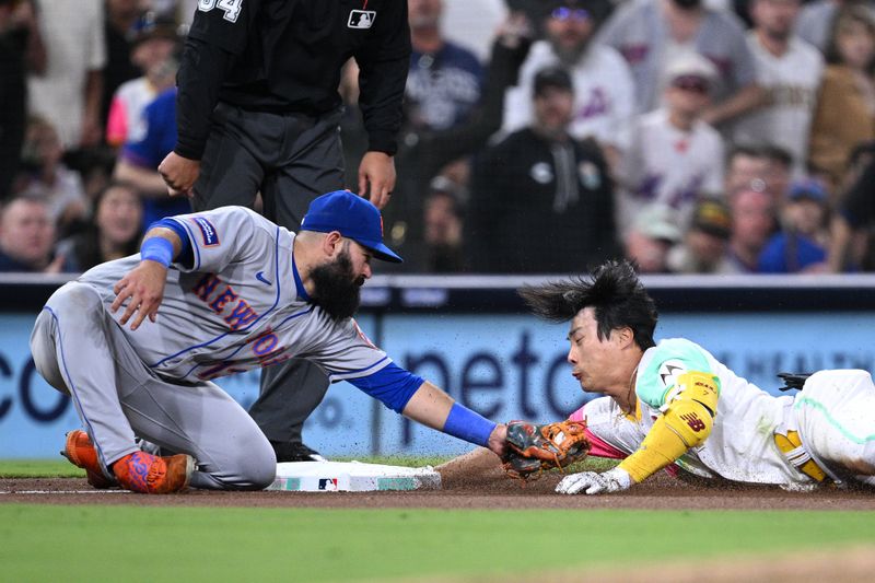 Jul 7, 2023; San Diego, California, USA; San Diego Padres second base Ha-seong Kim (7) is tagged out at third base by New York Mets third baseman Luis Guillorme (13) attempting to stretch a double during the seventh inning at Petco Park. Mandatory Credit: Orlando Ramirez-USA TODAY Sports