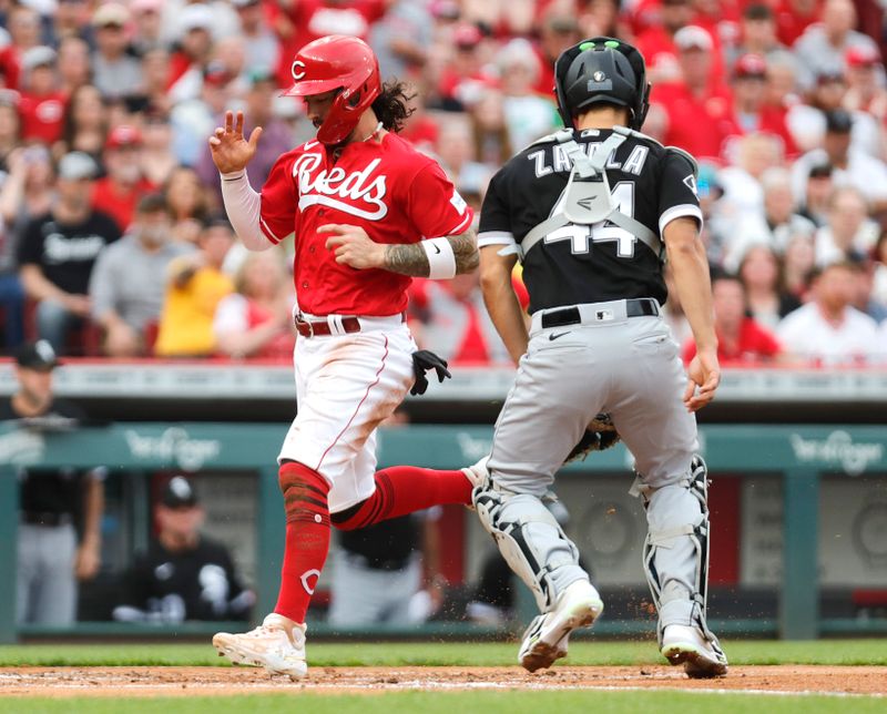 May 6, 2023; Cincinnati, Ohio, USA; Cincinnati Reds second baseman Jonathan India (6) scores against Chicago White Sox catcher Seby Zavala (44) during the first inning at Great American Ball Park. Mandatory Credit: David Kohl-USA TODAY Sports