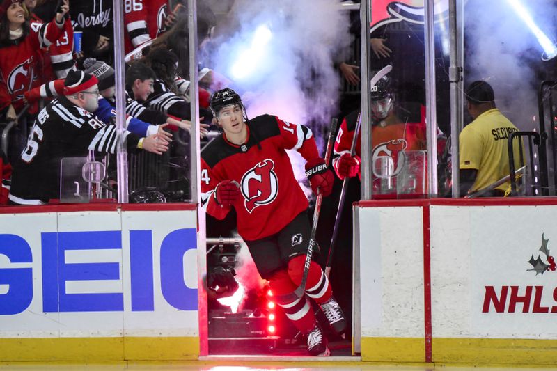 Nov 18, 2023; Newark, New Jersey, USA; New Jersey Devils right wing Nathan Bastian (14) enters the ice for pregame warmups prior to a game against the New York Rangers at Prudential Center. Mandatory Credit: John Jones-USA TODAY Sports