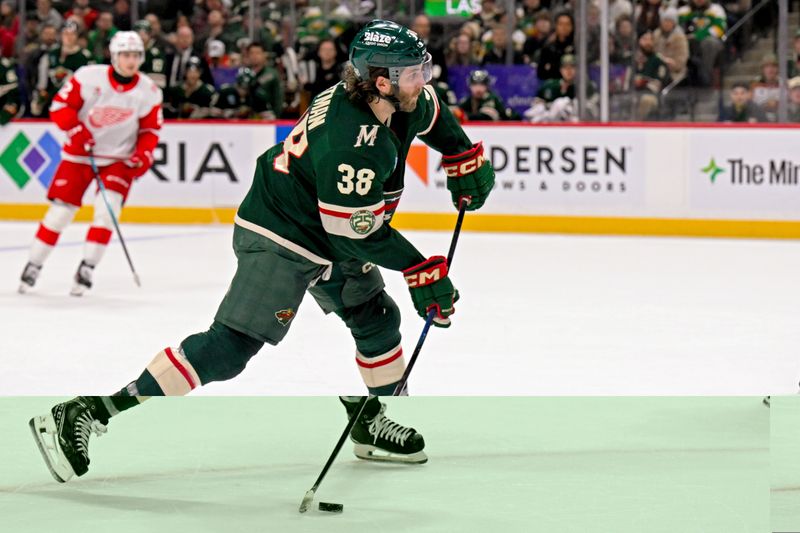 Jan 22, 2026; Saint Paul, Minnesota, USA;  Minnesota Wild forward Ryan Hartman (38) shoots the puck against the Detroit Red Wings during the second period at Grand Casino Arena. Mandatory Credit: Nick Wosika-Imagn Images