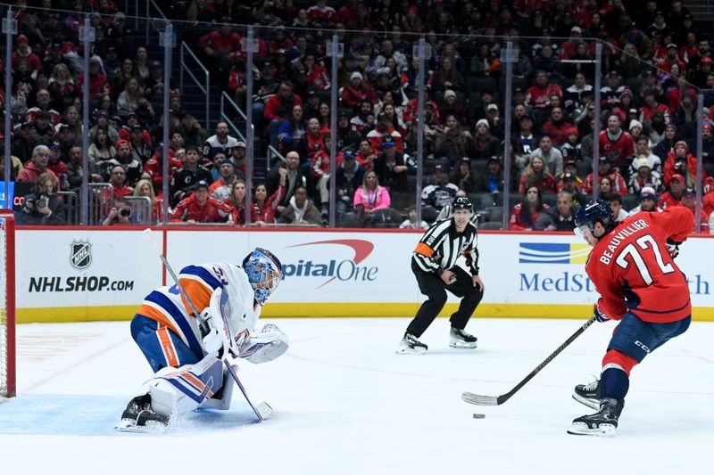 Feb 2, 2026; Washington, District of Columbia, USA; New York Islanders goaltender David Rittich (33) defends the net against Washington Capitals left wing Anthony Beauvillier (72) during the first period at Capital One Arena. Mandatory Credit: Hannah Foslien-Imagn Images