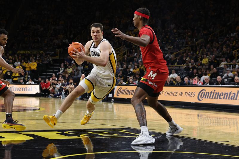 Jan 15, 2023; Iowa City, Iowa, USA; Maryland Terrapins forward Julian Reese (10) defends Iowa Hawkeyes forward Filip Rebraca (0) at Carver-Hawkeye Arena.  The Hawkeyes beat the Terrapins 81 to 67. Mandatory Credit: Reese Strickland-USA TODAY Sports