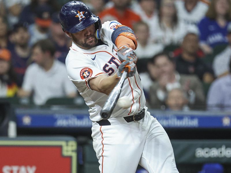 Apr 3, 2024; Houston, Texas, USA; Houston Astros left fielder Chas McCormick (20) hits an RBI single during the fifth inning against the Toronto Blue Jays at Minute Maid Park. Mandatory Credit: Troy Taormina-USA TODAY Sports