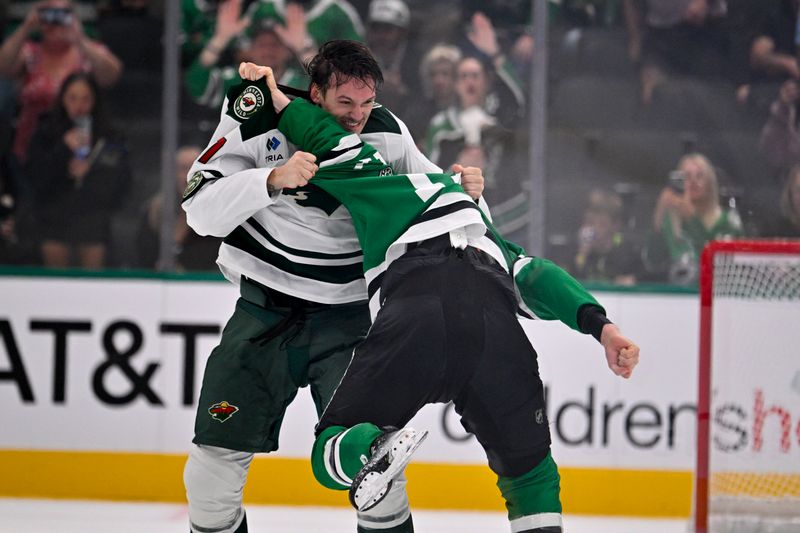 Sep 23, 2025; Dallas, Texas, USA; Minnesota Wild left wing Bradley Marek (47) fights with Dallas Stars right wing Kole Lind (17) during the third period at American Airlines Center. Mandatory Credit: Jerome Miron-Imagn Images