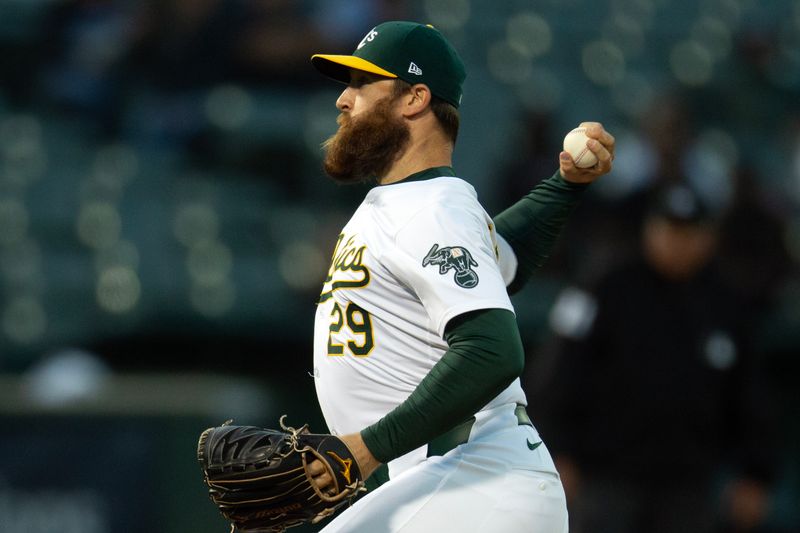 Jun 5, 2024; Oakland, California, USA; Oakland Athletics pitcher Austin Adams (29) delivers a pitch against the Seattle Mariners during the seventh inning at Oakland-Alameda County Coliseum. Mandatory Credit: D. Ross Cameron-USA TODAY Sports