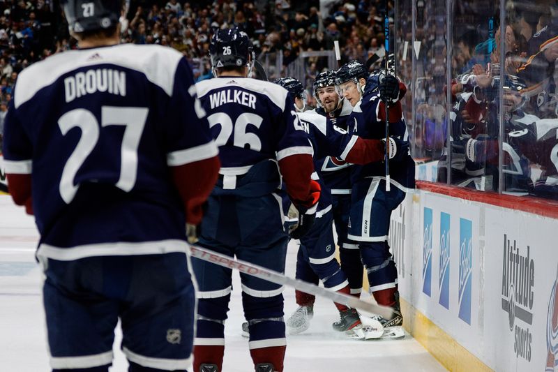 Apr 9, 2024; Denver, Colorado, USA; Colorado Avalanche center Nathan MacKinnon (29) celebrates his hat trick goal with teammates in the second period against the Minnesota Wild at Ball Arena. Mandatory Credit: Isaiah J. Downing-USA TODAY Sports