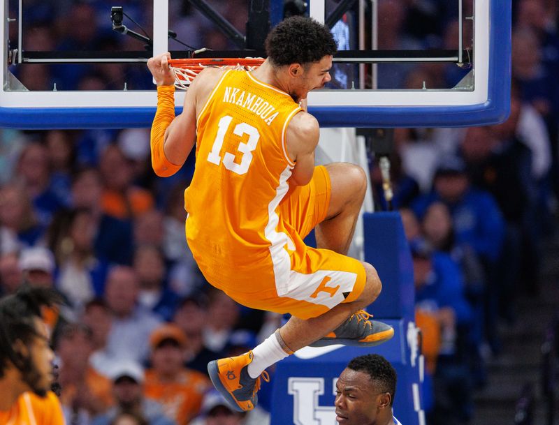 Feb 18, 2023; Lexington, Kentucky, USA; Tennessee Volunteers forward Olivier Nkamhoua (13) dunks the ball during the second half against the Kentucky Wildcats at Rupp Arena at Central Bank Center. Mandatory Credit: Jordan Prather-USA TODAY Sports