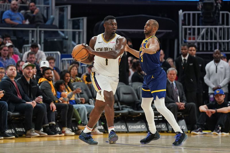 SAN FRANCISCO, CA - APRIL 12: Zion Williamson #1 of the New Orleans Pelicans dribbles the ball in the second quarter against Chris Paul #3 of the Golden State Warriors at Chase Center on April 12, 2024 in San Francisco, California. NOTE TO USER: User expressly acknowledges and agrees that, by downloading and/or using this photograph, User is consenting to the terms and conditions of the Getty Images License Agreement. (Photo by Kavin Mistry/Getty Images)