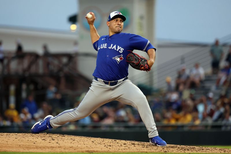 Mar 21, 2024; Bradenton, Florida, USA; Toronto Blue Jays pitcher Paolo Espino (52) throws a pitch during the fifth inning against the Pittsburgh Pirates at LECOM Park. Mandatory Credit: Kim Klement Neitzel-USA TODAY Sports