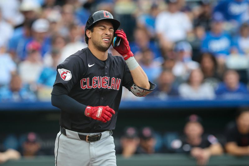 Jun 28, 2023; Kansas City, Missouri, USA; Cleveland Guardians outfielder Tyler Freeman (2) reacts to being hit by a pitch during the first inning against the Kansas City Royals at Kauffman Stadium. Mandatory Credit: William Purnell-USA TODAY Sports