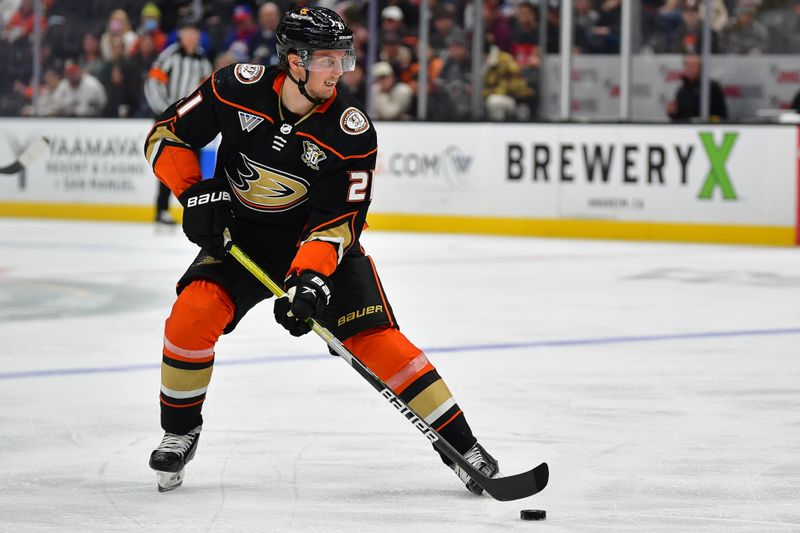 Jan 5, 2024; Anaheim, California, USA; Anaheim Ducks center Isac Lundestrom (21) moves the puck against the Winnipeg Jets during the second period at Honda Center. Mandatory Credit: Gary A. Vasquez-USA TODAY Sports