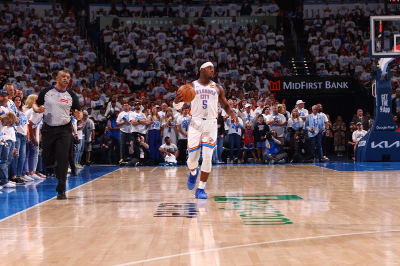 OKLAHOMA CITY, OK - APRIL 21:  Luguentz Dort #5 of the Oklahoma City Thunder handles the ball during the game   against the New Orleans Pelicans during Round 1 Game 1 of the 2024 NBA Playoffs on April 21, 2024 at Paycom Arena in Oklahoma City, Oklahoma. NOTE TO USER: User expressly acknowledges and agrees that, by downloading and or using this photograph, User is consenting to the terms and conditions of the Getty Images License Agreement. Mandatory Copyright Notice: Copyright 2024 NBAE (Photo by Zach Beeker/NBAE via Getty Images)