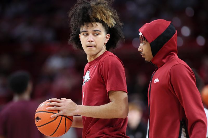 Feb 11, 2023; Fayetteville, Arkansas, USA; Arkansas Razorbacks guards Anthony Black and Nick Smith Jr. during pregame warmups prior to facing the Mississippi State Bulldogs at Bud Walton Arena. Mandatory Credit: Nelson Chenault-USA TODAY Sports