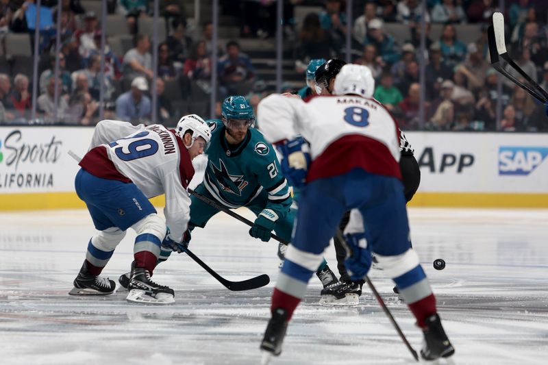 Nov 1, 2025; San Jose, California, USA; San Jose Sharks center Alexander Wennberg (21) and Colorado Avalanche center Nathan MacKinnon (29) faceoff to start the game at SAP Center at San Jose. Mandatory Credit: Dennis Lee-Imagn Images