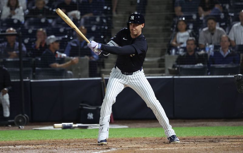 Mar 3, 2025; Tampa, Florida, USA;  New York Yankees outfielder Cody Bellinger (35) hits an RBI single during the fifth inning against the Pittsburgh Pirates at George M. Steinbrenner Field. Mandatory Credit: Kim Klement Neitzel-Imagn Images