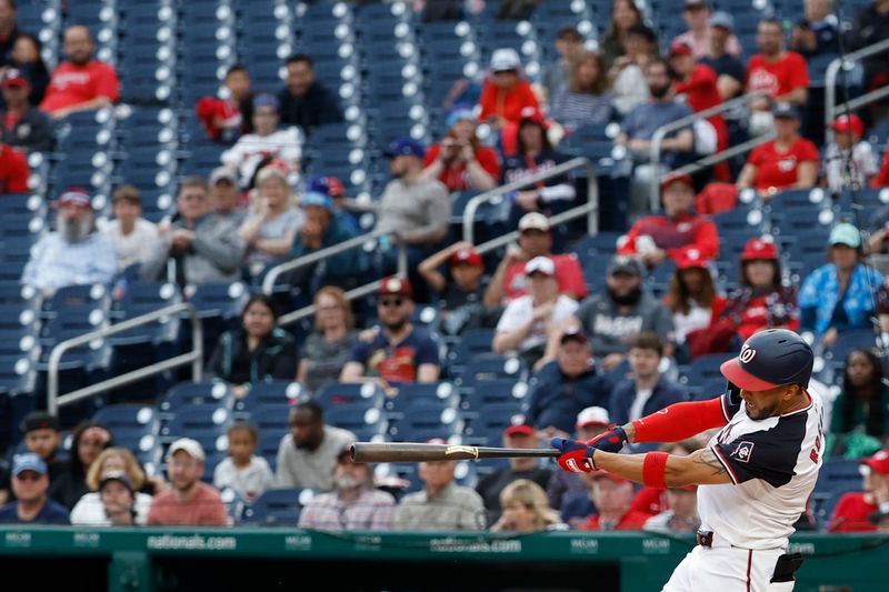 May 5, 2024; Washington, District of Columbia, USA; Washington Nationals outfielder Eddie Rosario (8) hits a go ahead two run home run against the Toronto Blue Jays during the seventh inning at Nationals Park. Mandatory Credit: Geoff Burke-USA TODAY Sports