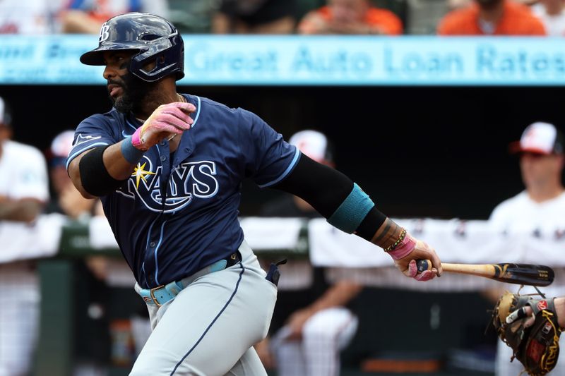 Jun 29, 2025; Baltimore, Maryland, USA; Tampa Bay Rays first baseman Yandy Diaz (2) hits a single during the first inning against the Baltimore Orioles at Oriole Park at Camden Yards. Mandatory Credit: Daniel Kucin Jr.-Imagn Images