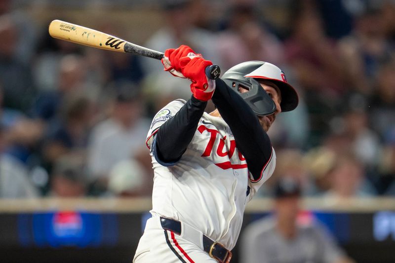 Sep 15, 2025; Minneapolis, Minnesota, USA; Minnesota Twins first baseman Edouard Julien (47) hits a single against the New York Yankees in the fifth inning at Target Field. Mandatory Credit: Jesse Johnson-Imagn Images
