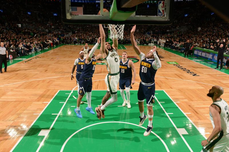 BOSTON, MA - JANUARY 19:  Jayson Tatum #0 of the Boston Celtics drives to the basket during the game against the Denver Nuggets on January 19, 2024 at the TD Garden in Boston, Massachusetts. NOTE TO USER: User expressly acknowledges and agrees that, by downloading and or using this photograph, User is consenting to the terms and conditions of the Getty Images License Agreement. Mandatory Copyright Notice: Copyright 2024 NBAE  (Photo by Brian Babineau/NBAE via Getty Images)