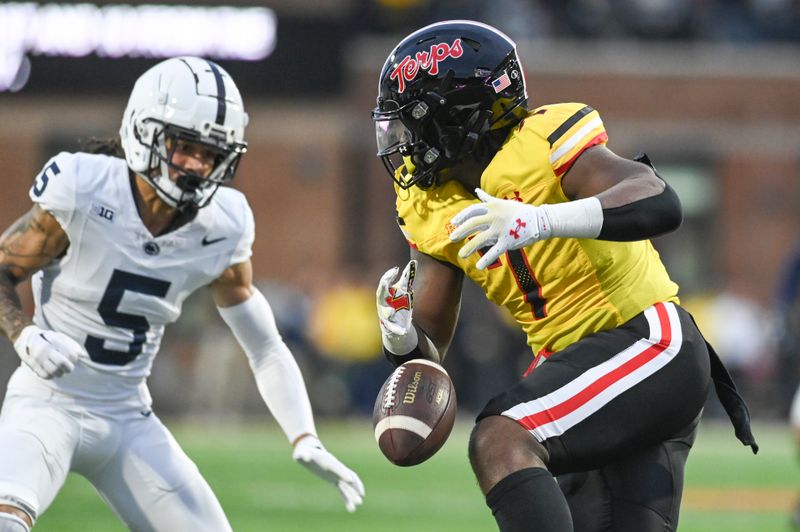 Nov 4, 2023; College Park, Maryland, USA;\h7o]\ drops as pass as Penn State Nittany Lions cornerback Cam Miller (5) closes during the second half   at SECU Stadium. Mandatory Credit: Tommy Gilligan-USA TODAY Sports