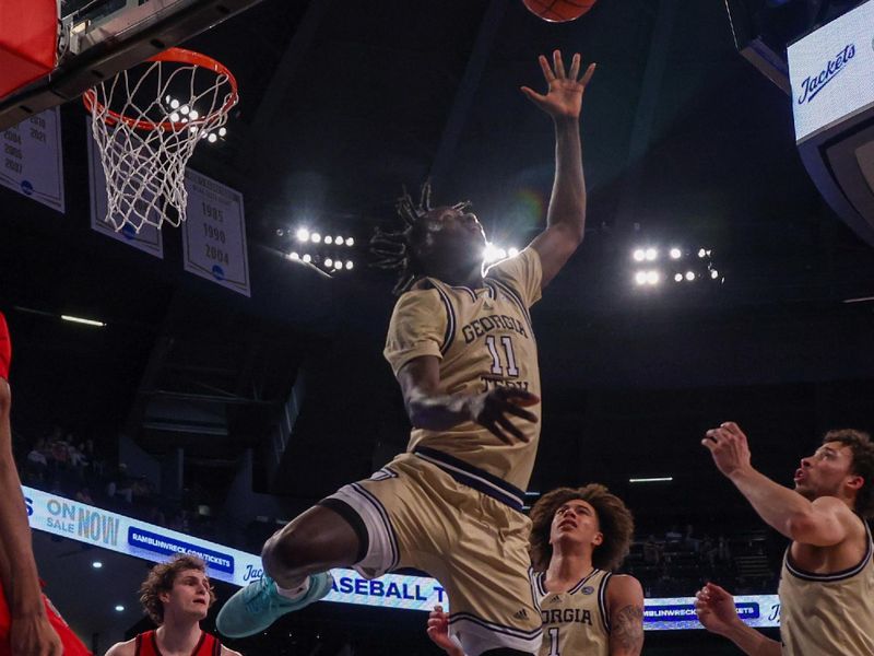 Mar 1, 2025; Atlanta, Georgia, USA; Georgia Tech Yellow Jackets forward Baye Ndongo (11) grabs a rebound against the North Carolina State Wolfpack in the first half at McCamish Pavilion. Mandatory Credit: Brett Davis-Imagn Images